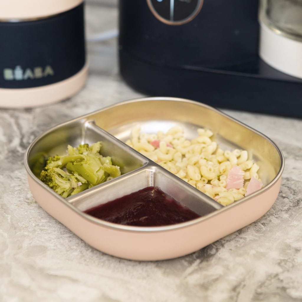 Cotton Candy Beaba divided plate with separate foods on a kitchen bench