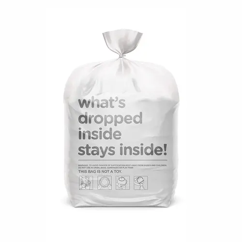 White MAGIC nappy bin bag tied closed with printed odour-containment message